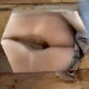 A woman is video-recorded from underneath an outhouse floor opening as she takes a shit. Unfortunately, this cameraman sucks, and he focuses more on her private parts than the ongoing poop action.
